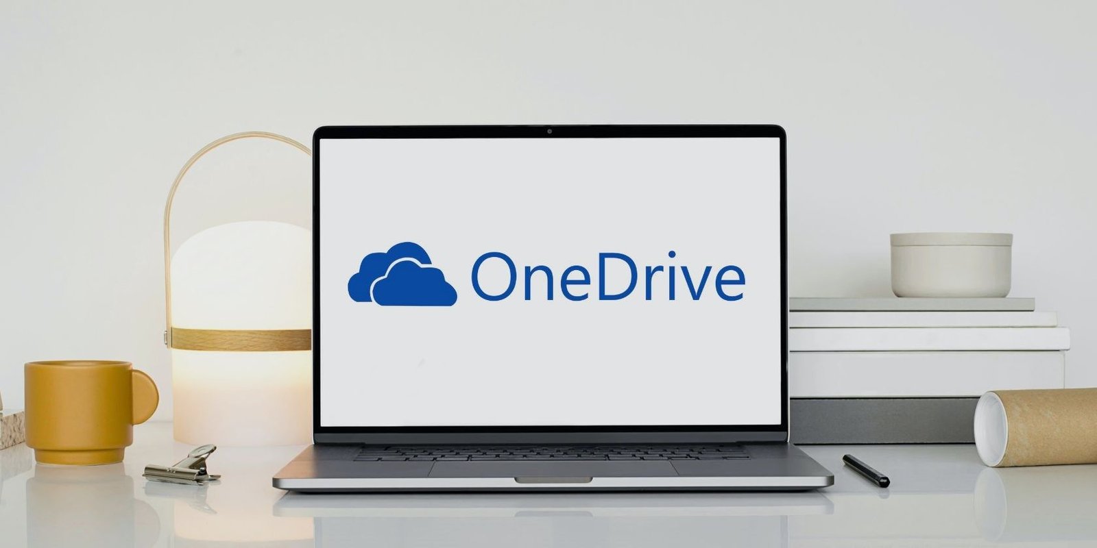 Desarrollador Web Freelance | Wordpress | | laptop with a onedrive logo on white wooden table